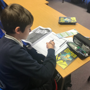 Photo of a student studying a book